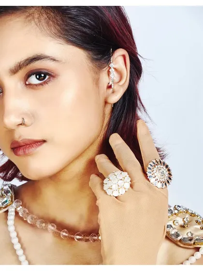 A successful jewellery shoot is all about the details. This close-up was lit to make every facet of the rings and the delicate ear cuff sparkle. The focus is entirely on the craftsmanship of the pieces, making it perfect for a brand lookbook or commercial campaign.