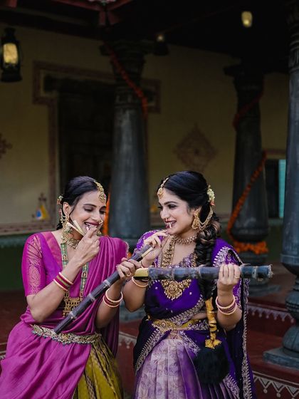 A playful moment during a Sankranti shoot, with the women enjoying sugarcane, a key element of the harvest festival.