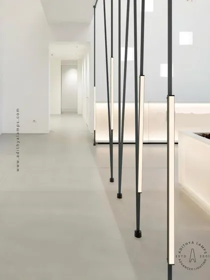 A stunning installation of the Braided Tape Series as vertical floor-to-ceiling pendants. The linear lights create a forest of light, defining the hallway space with a powerful and artistic statement.