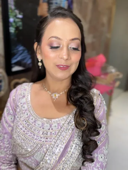 A close-up of a soft glam look. The lavender eyeshadow and mauve lip create a beautiful, harmonious look.