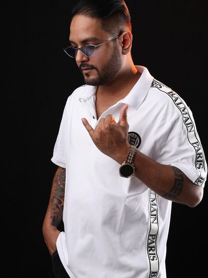 A cool and casual pose in a white polo shirt. This was part of a promotional shoot for a busy weekend of gigs.