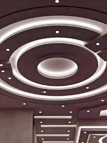 A large, circular design with multiple rings and levels. This type of ceiling is perfect for large halls or banquet rooms, creating a sense of grandeur.