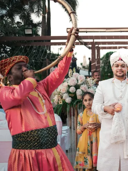A traditional musician announces the groom's arrival. We document all the cultural elements and vendors that make your wedding day unique.