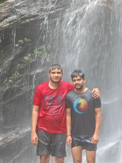 Two friends enjoying the cool water of Hidlumane Falls.