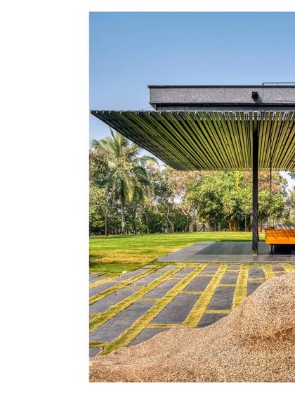 A detail of the pergola and seating area. The design focuses on creating comfortable, shaded outdoor spaces that encourage a life lived in connection with nature.
