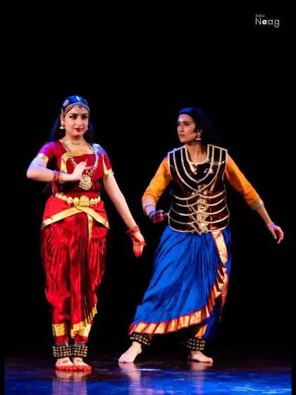 A scene from "The Wheel of Choices," where I am in character as Karna. The costuming and interactive pose with another dancer highlight my experience in ensemble productions and character portrayal.