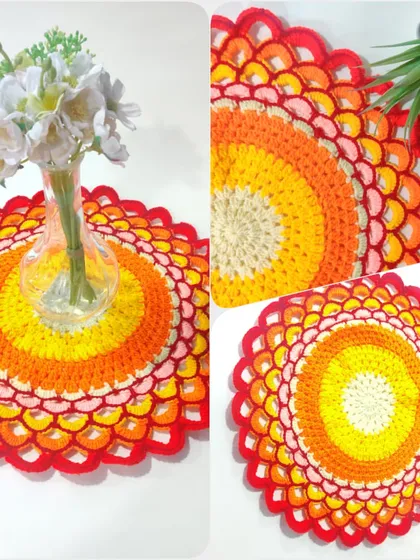 Color brings joy, and this fiery-hued doily is all about celebrating that. It is a versatile piece that can be used as a vibrant thali cover, a placemat, or a centerpiece to brighten any room.