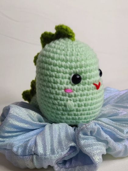 My tiny dino keychains are a handful of cuteness. They come in four different colors: blue, yellow, green, and grey.