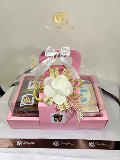 The fully assembled pink Rakhi hamper, beautifully decorated and ready for gifting.