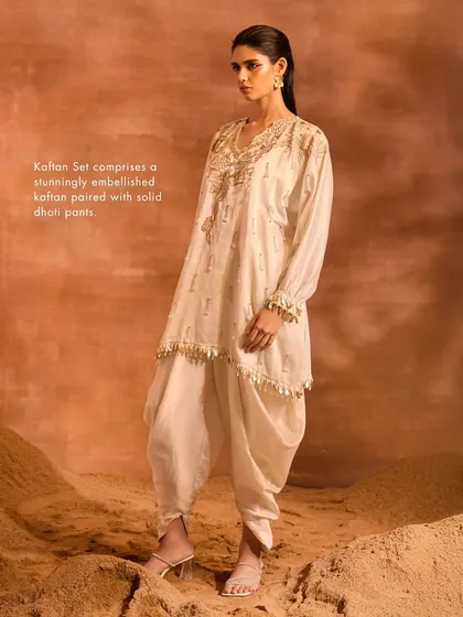 This shot highlights the stunningly embellished kaftan paired with solid dhoti pants, a key feature of the Orion Kaftan Set.