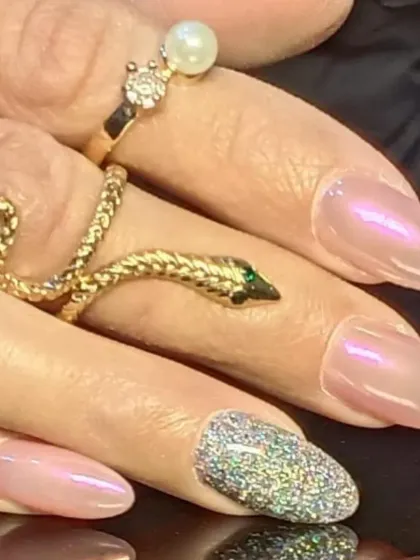 A side view of the holographic glitter accent nail, showing off its incredible sparkle.