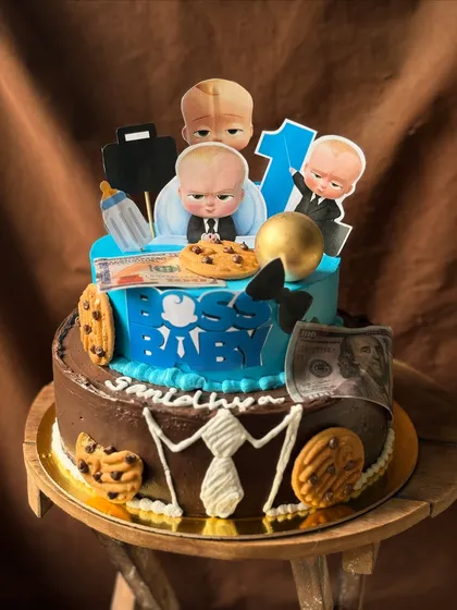 This two-tier Boss Baby themed cake was so much fun to create for a first birthday party. I specialize in fondant-free designs, using buttercream and custom toppers to bring any theme to life for your little one's big day.
