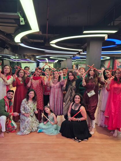 The smiles say it all. A happy group posing with their dandiya sticks after a fun-filled session at 21 Fitness GK2. I make sure my classes feel like a party with friends.