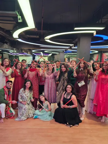 The smiles say it all. A happy group posing with their dandiya sticks after a fun-filled session at 21 Fitness GK2. I make sure my classes feel like a party with friends.
