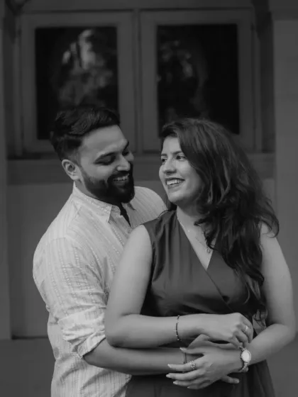 A classic black and white portrait that feels timeless. The focus here is entirely on their expressions and the joyful interaction between them, proving that great emotional storytelling doesn't always need color.