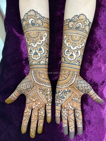 Symmetrical and bold, this engagement design uses negative space to make the bell and floral patterns pop.