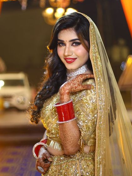 Another smiling portrait of the reception bride. Her happiness and the flawless makeup are a perfect match.