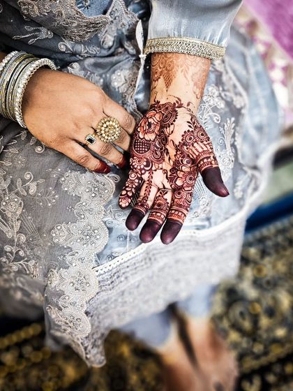 A full view of the hand, showcasing the rich and even stain color.