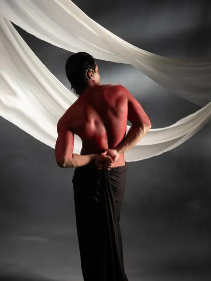 A view from the back, showing the even and complete coverage of the red body paint, a testament to the meticulous application process.