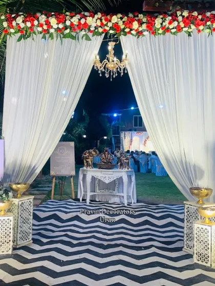 It's the personal details that make a wedding unique. For this entrance, we designed a custom welcome sign for the couple, paired with decorative stands, a bold chevron-patterned carpet, and a beautiful Ganesh idol for blessings.