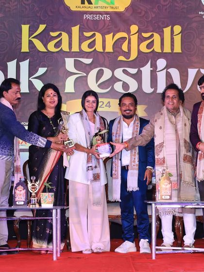 Posing with other dignitaries after receiving an award at the festival. These events are wonderful opportunities to connect with fellow artists and patrons.