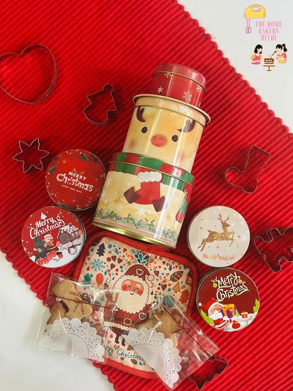 Here is everything that comes in our Christmas Cookie Decorating Tin. You get a three-tier tin filled with cookies, icing bags, and sprinkles, along with cookie cutters for your own baking adventures.
