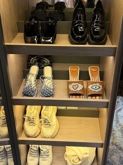 Unique and stylish footwear deserves to be seen. We arrange shoes on open shelves to highlight their design, making them part of the room's decor.
