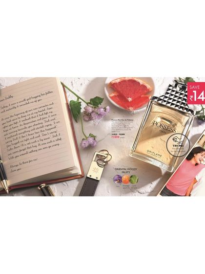 Another Father's Day concept for Oriflame's Possess perfume, styled as a flat lay on a desk. The inclusion of a smartphone, keys, and grapefruit slices adds a modern and fresh touch to the scene.