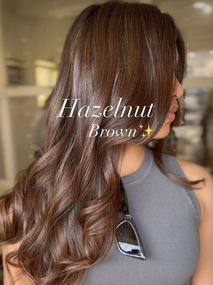 Get the perfect hazelnut brown balayage without the damage. This look features soft, rich tones that add beautiful dimension while keeping the hair healthy and shiny.