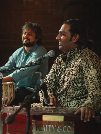 A smiling performance shot with Sanam Khan.