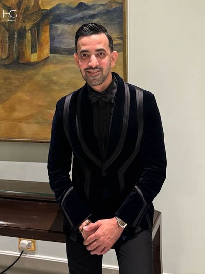 Another shot of Ali Baldiwala, showing his confidence in the bespoke velvet tuxedo. It's a perfect example of a garment made for a man of the hour.