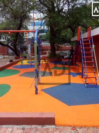 A completed outdoor playground project. I used poured EPDM rubber flooring in different colors and shapes to create a fun, safe, and seamless play surface.