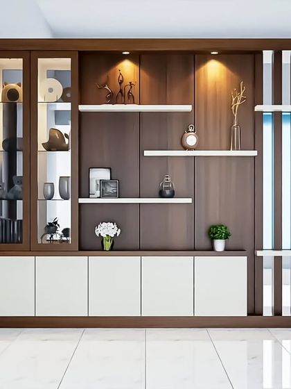A large crockery unit with a mix of glass-front display cabinets, open shelves, and closed storage. The wood and white combination is timeless and elegant.