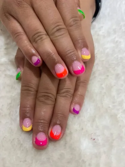 It’s raining colors at my studio. These neon French tips were done with a gel overlay to strengthen the client's natural nails.