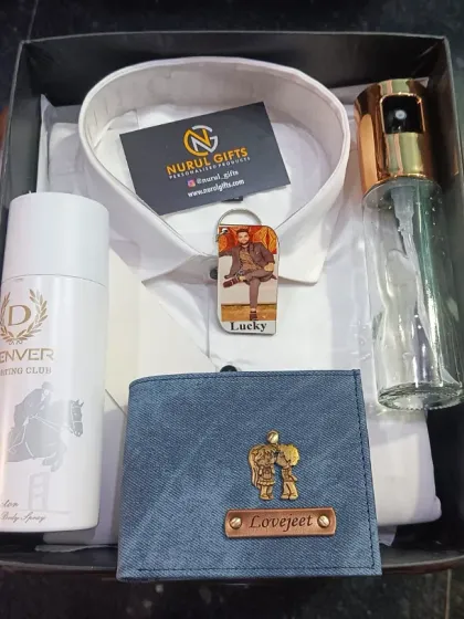 This summer-themed hamper includes a white cotton shirt, a personalized wallet, a photo keychain, a spray bottle, and deodorant.