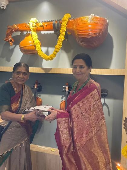 Presenting a gift at the opening of the music store. It's a joy to see the next generation take their passion for music and turn it into something that serves the wider community.