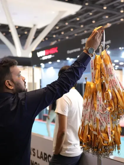 An attendee reaches for their delegate pass, the all-access key to three days of innovation, networking, and learning at the Smart Home Expo.