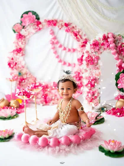 A sweet and serene portrait of this little one dressed as Krishna.