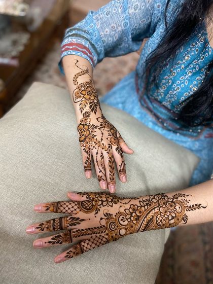 A view of two different Arabic-style designs, one a floral vine and the other a fuller pattern.