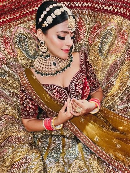 An aerial shot showcasing the beautiful flare and intricate paisley designs of this bridal lehenga.