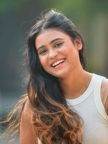 A tight close up on a radiant smile. This shot is all about capturing happiness and positive energy, perfect for a profile picture.