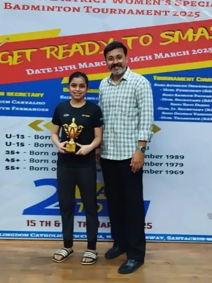 Another champion from the WCG Women's Special Tournament posing with her trophy and me.