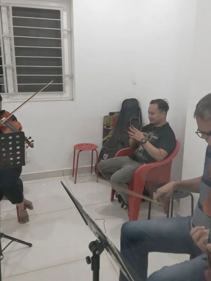 Another view of our violin class, with students practicing together.