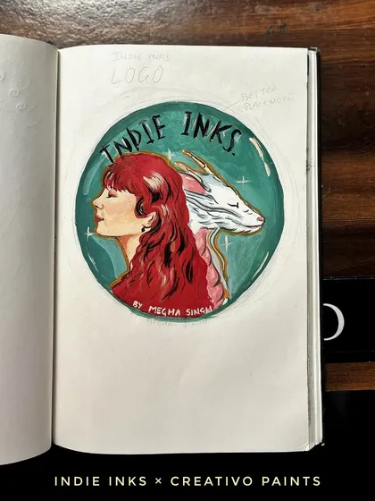 The finished, hand-painted logo in my sketchbook. I used watercolors to bring the design to life with a vibrant red-haired figure and a mythical dragon.