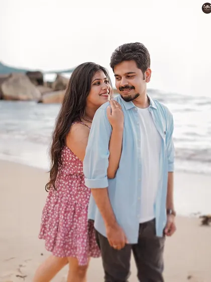 A candid, playful moment from a casual beach photoshoot. I love capturing the glances and smiles that happen between poses.