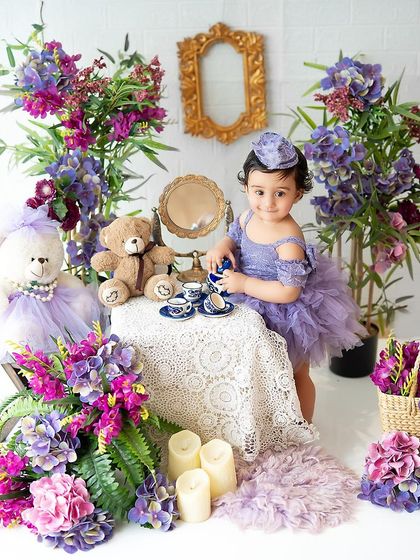 A tea party for one! This adorable setup with a miniature tea set and teddy bears is perfect for a whimsical and imaginative sitter session.