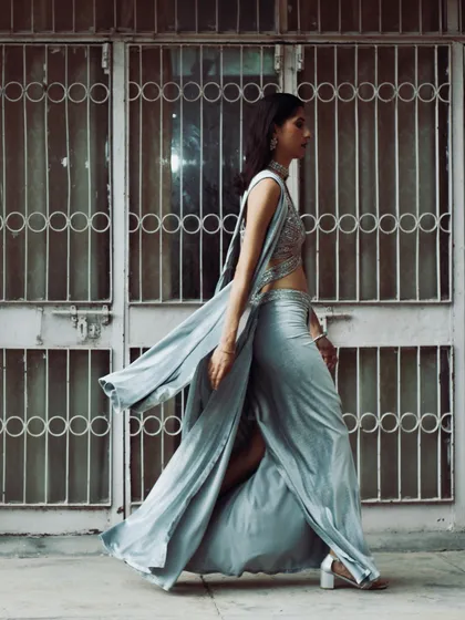 A candid walking shot that captures the beautiful flow and drape of the silver sari. I always style for movement and real-life wearability.