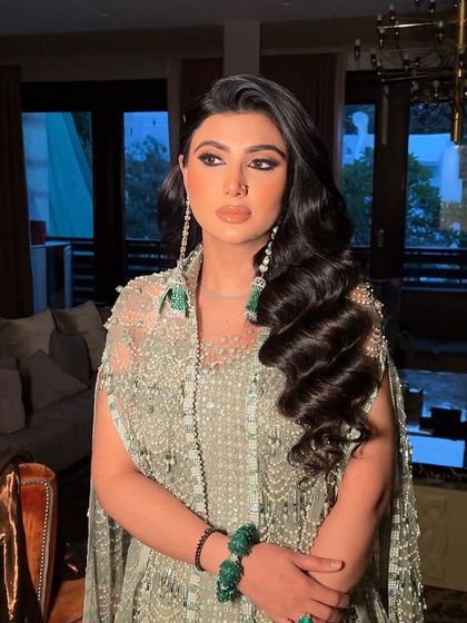 The side profile highlights the gentle flow and healthy shine of the hair.