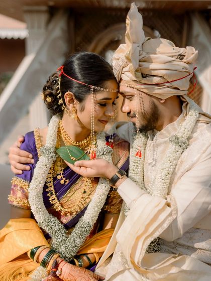 An intimate couple portrait, showcasing the traditional details of a Maharashtrian wedding.