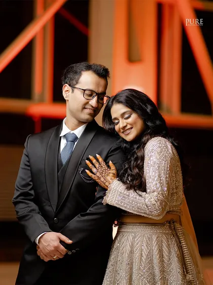 A tender moment between the couple. The soft lighting and their gentle expressions create a romantic and heartfelt portrait.